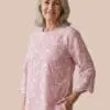 Women’s pink embroidered cotton tunic with textured floral pattern and scalloped hem
