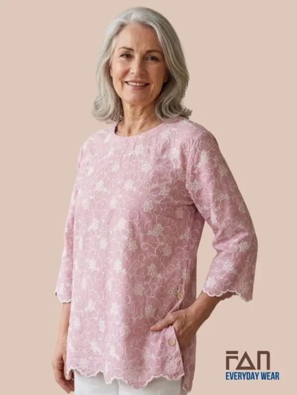 Women’s pink embroidered cotton tunic with textured floral pattern and scalloped hem