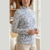 Printed floral turtleneck top for mature women in blue-white and sage